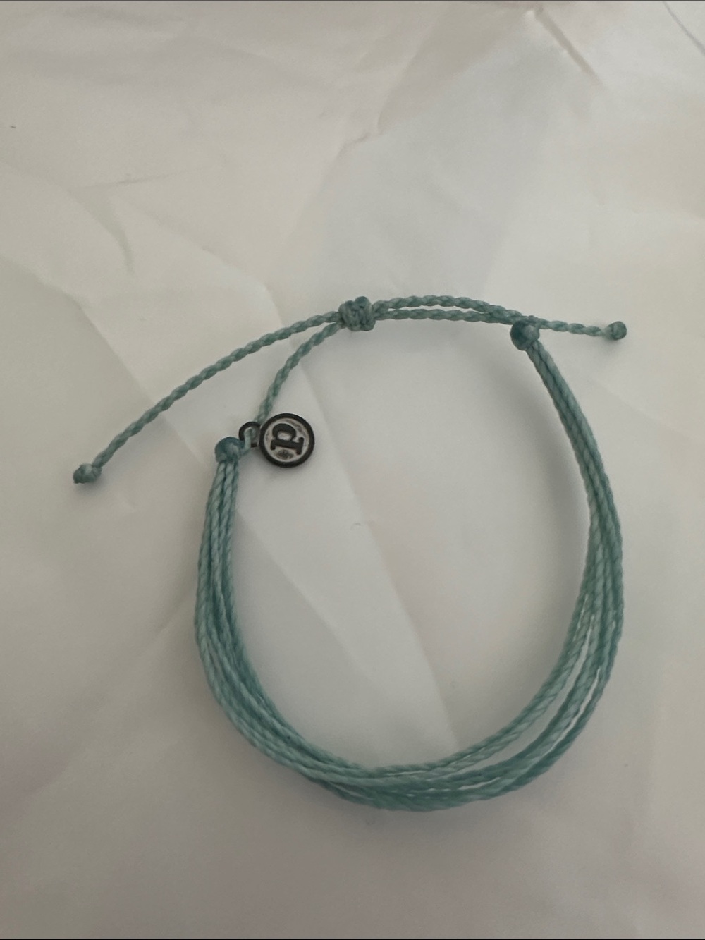 NWOT Pura Vida Aqua Woven String Bracelet with Round Logo Charm